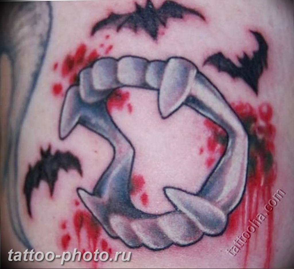 plastic vampire teeth tattoo