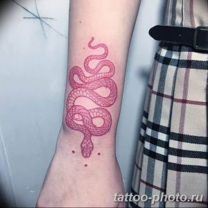 bicep tattoo snake Freehand red snake tattoo on the left wrist A