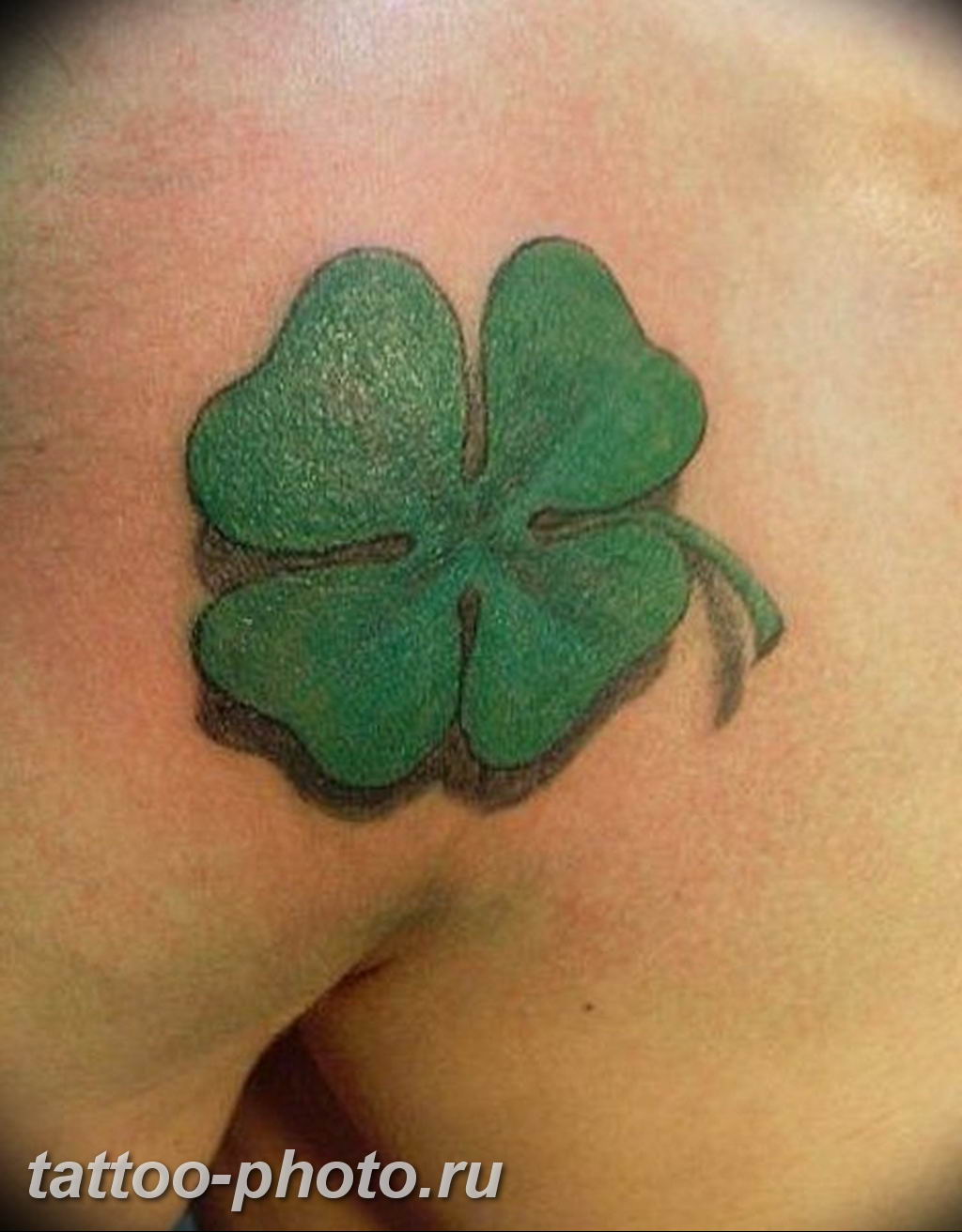 Realistic four leaf clover tattoo