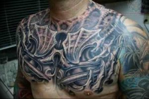 фото тату биомеханика на груди 06.04.2019 №014 - chest biomechanics tatt - tattoo-photo.ru