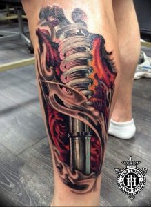 фото биомеханика на икре тату 06.04.2019 №037 - biomechanics on the calf - tattoo-photo.ru