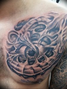 фото тату биомеханика на груди 06.04.2019 №002 - chest biomechanics tatt - tattoo-photo.ru