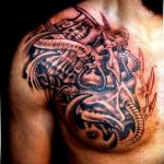 фото тату биомеханика на груди 06.04.2019 №017 - chest biomechanics tatt - tattoo-photo.ru