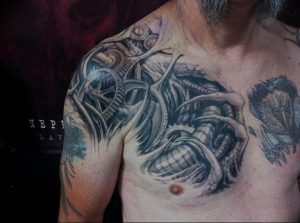 фото тату биомеханика на груди 06.04.2019 №045 - chest biomechanics tatt - tattoo-photo.ru