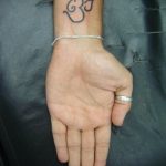 фото пример символ тату ОМ 08.02.2020 №034 -tattoo om- tattoo-photo.ru
