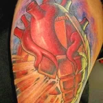 Фото тату сердце граната 02.01.22 №0009 - tattoo heart - tattoo-photo.ru