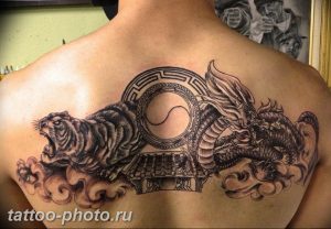 фото тату тигр и дракон 07.12.2018 №053 - tattoo tiger and dragon - tattoo-photo.ru