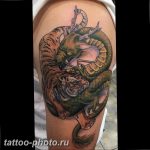 фото тату тигр и дракон 07.12.2018 №046 - tattoo tiger and dragon - tattoo-photo.ru